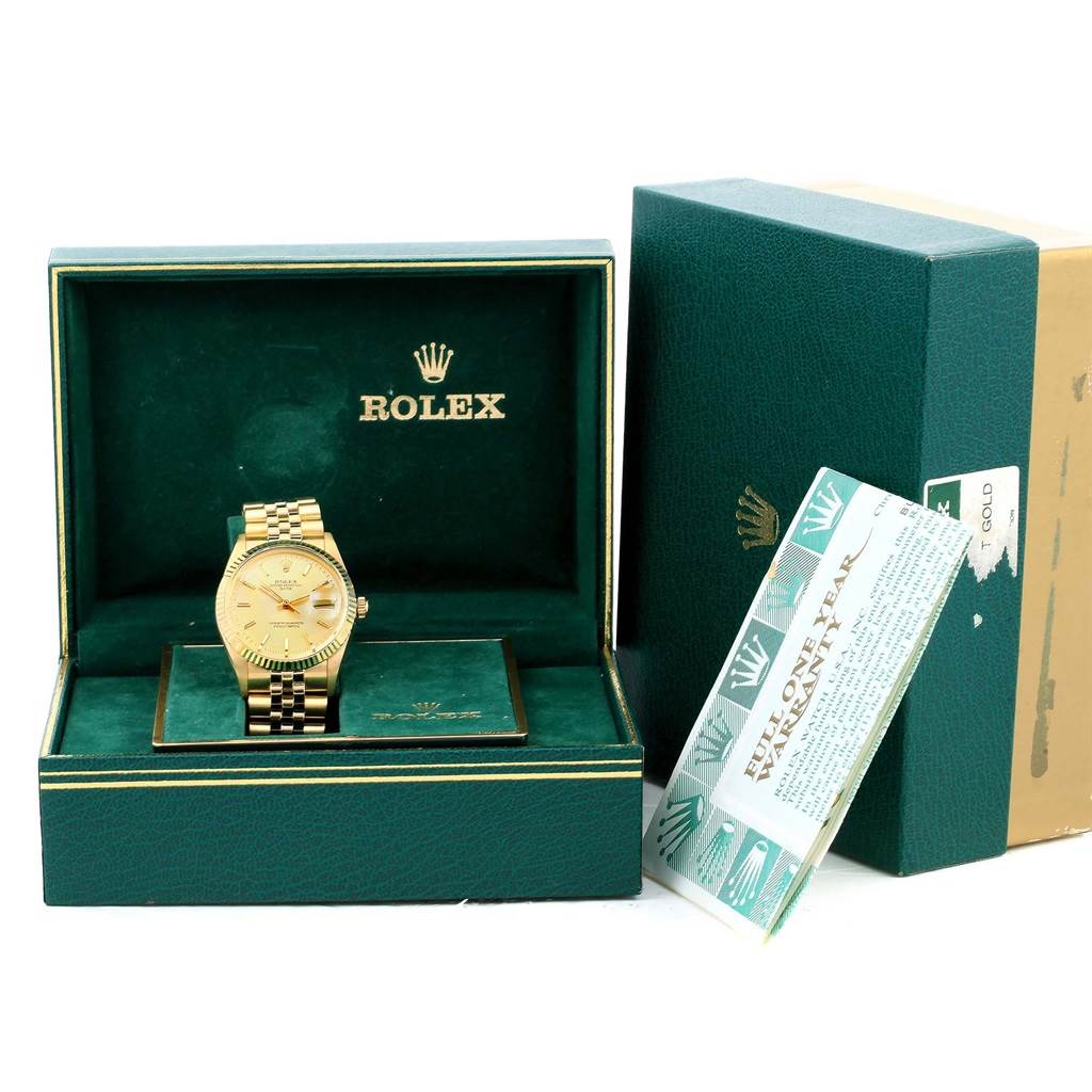 The Rolex Vintage Collection 15037 Men's Yellow Gold Champagne Dial 15037 Men's Yellow Gold Champagne Dial watch is shown front-on in its open box with accompanying warranty papers beside it.