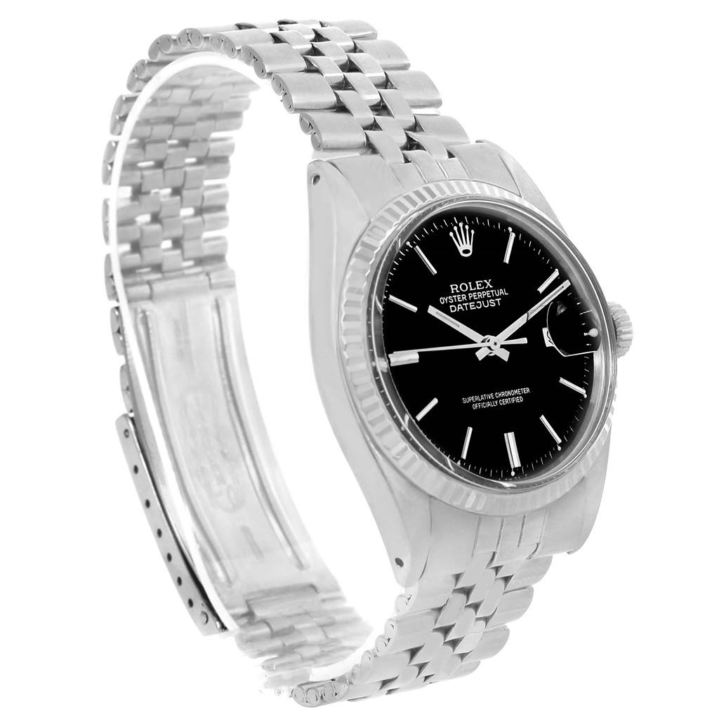 The image shows a Rolex Vintage Collection 1601 Men's Stainless Steel Black Dial 1601 Men's Stainless Steel Black Dial Datejust watch at a three-quarter angle, displaying the face, bezel, and part of the bracelet.