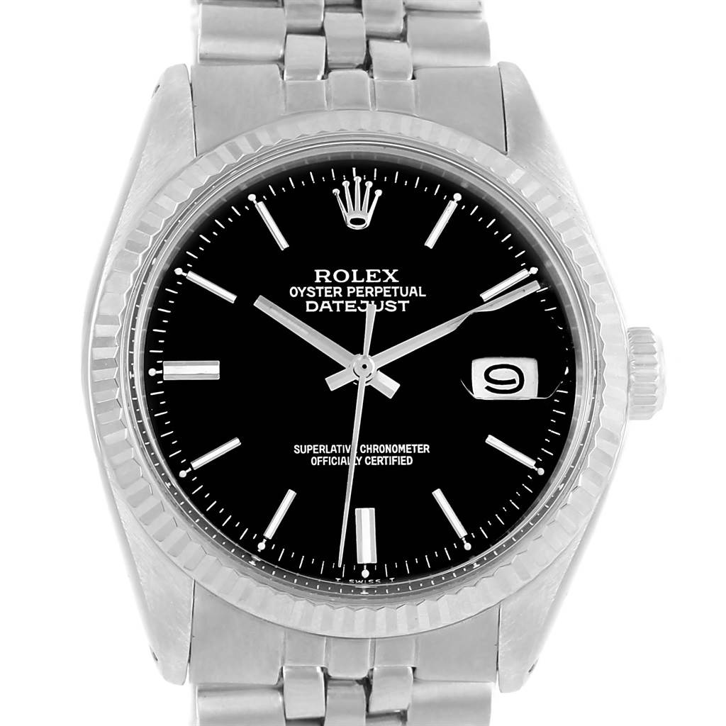 This photo shows a frontal view of a Rolex Vintage Collection 1601 Men's Stainless Steel Black Dial 1601 Men's Stainless Steel Black Dial Datejust watch, highlighting its black dial, crown, and stainless steel bracelet.