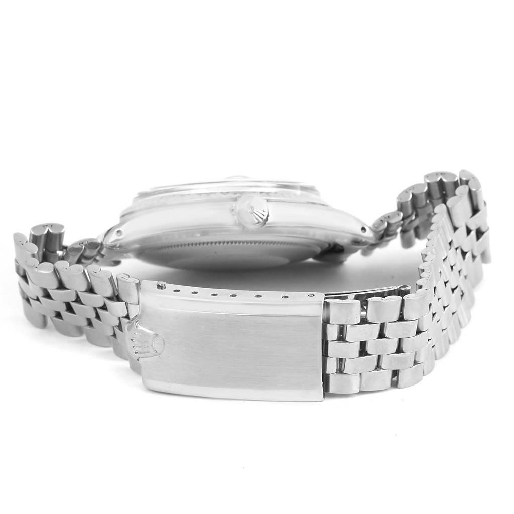 The image shows a side view of a Rolex Vintage Collection 1601 Men's Stainless Steel Black Dial 1601 Men's Stainless Steel Black Dial watch, focusing on its closed metal bracelet and clasp.