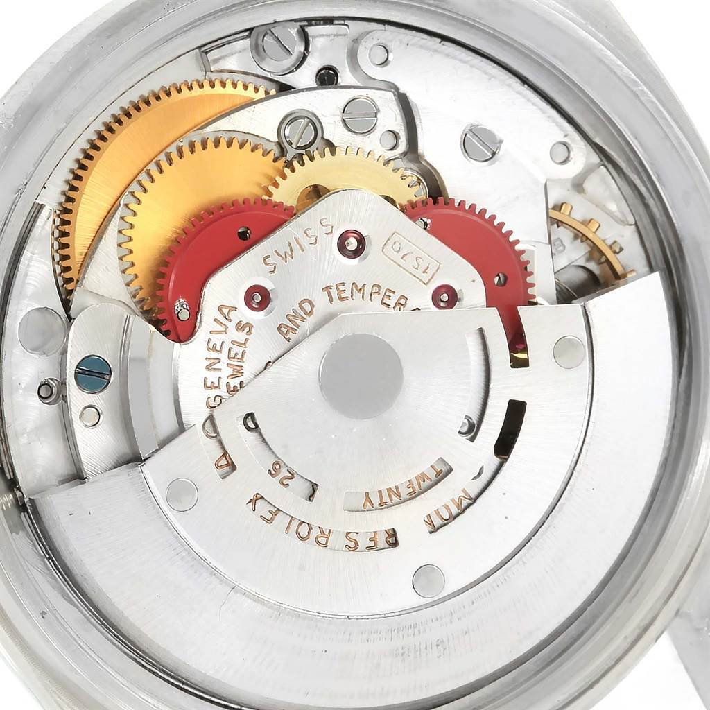 This is an internal view of the Rolex Vintage Collection 1601 Men's Stainless Steel Black Dial 1601 Men's Stainless Steel Black Dial watch, showing its intricate mechanical movement and gears.