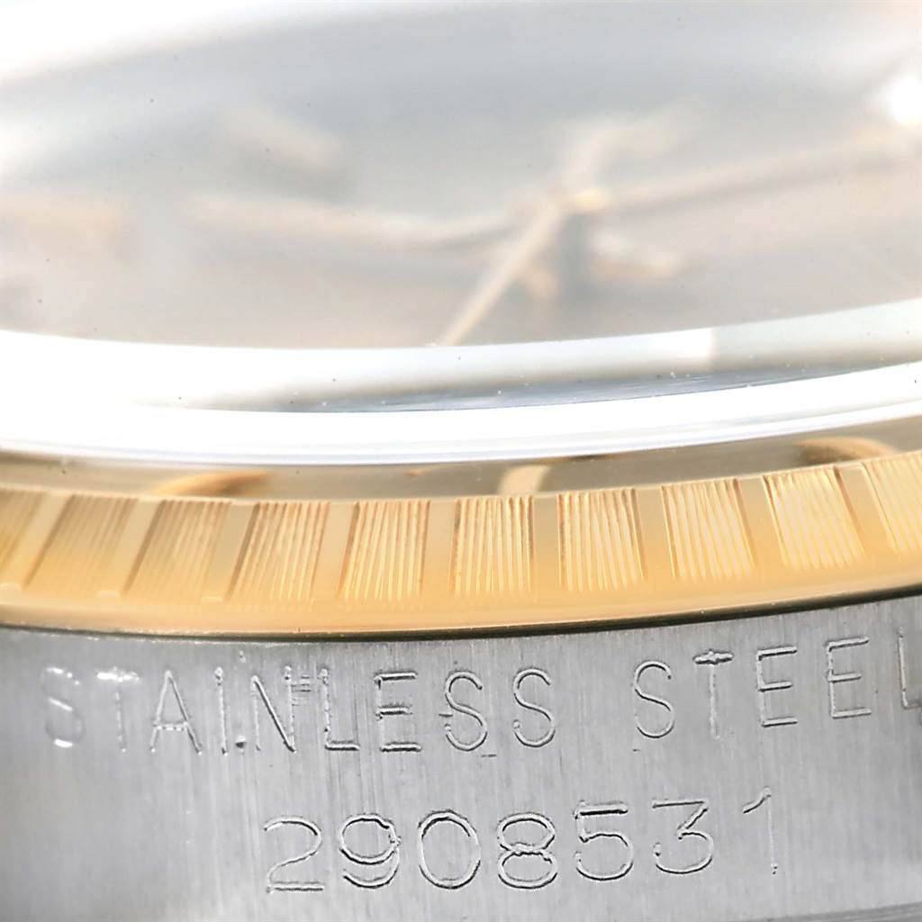 This close-up angle shows the side view of the bezel and serial number of the Rolex Vintage Collection 1505 Men's Steel and Gold (two tone) Champagne Dial 1505 Men's Steel and Gold (two tone) Champagne Dial watch.