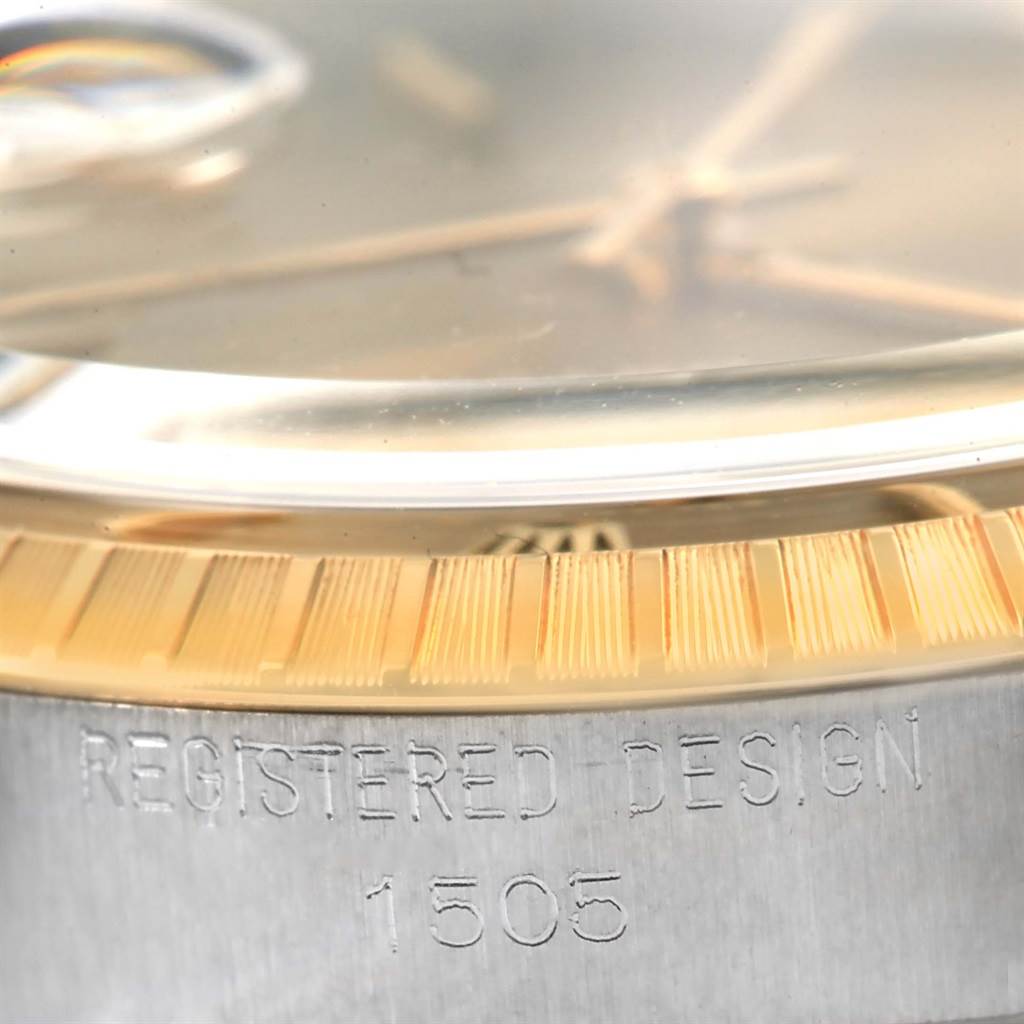 The image shows a close-up of the Rolex Vintage Collection 1505 Men's Steel and Gold (two tone) Champagne Dial 1505 Men's Steel and Gold (two tone) Champagne Dial model 1505, focusing on the edge of the case and part of the fluted bezel.