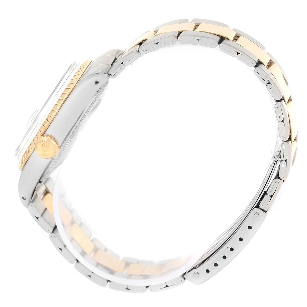 The image shows a side view of the Rolex Vintage Collection 1505 Men's Steel and Gold (two tone) Champagne Dial 1505 Men's Steel and Gold (two tone) Champagne Dial watch, highlighting its crown, bezel, case, and two-tone bracelet.