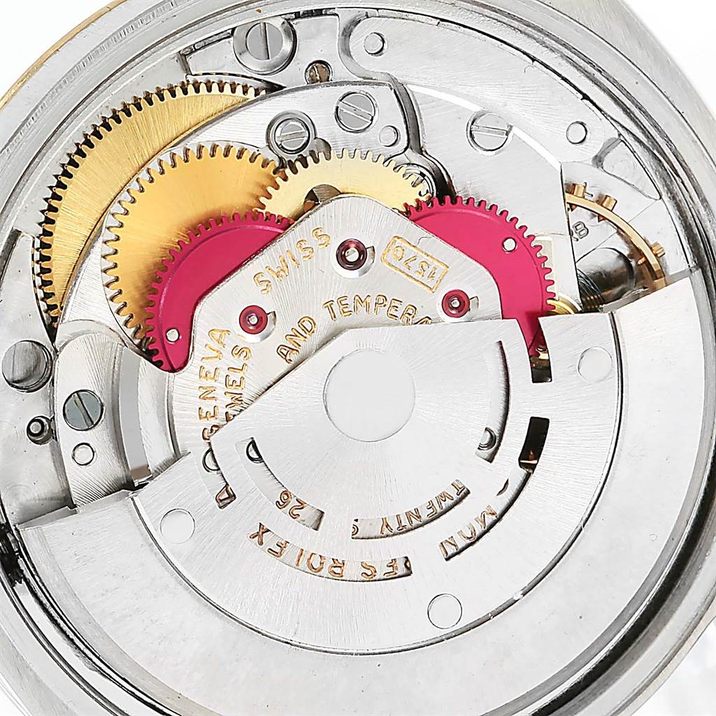 This is a close-up view of the internal movement of a Vintage Collection model by Rolex, showcasing gears and mechanical parts.