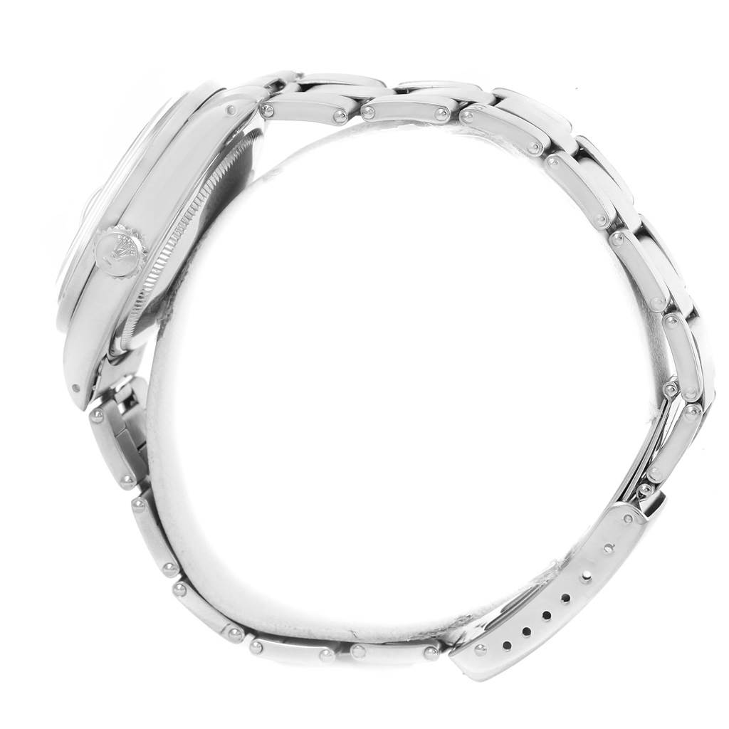 This image shows a side view of a Rolex Vintage Collection 1501 Men's Stainless Steel White Dial 1501 Men's Stainless Steel White Dial watch, focusing on the case and metal bracelet.