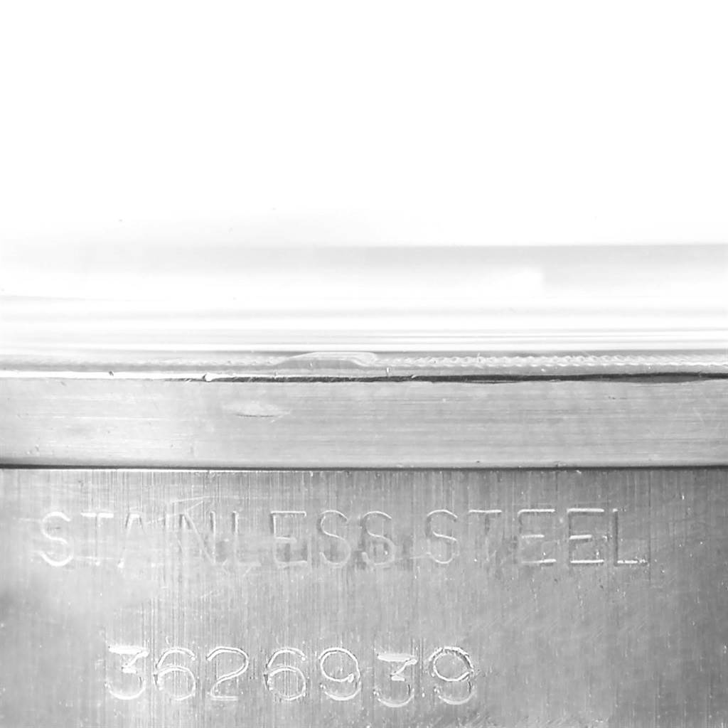 This image shows a close-up of the case back engraving on a Vintage Collection model by Rolex.