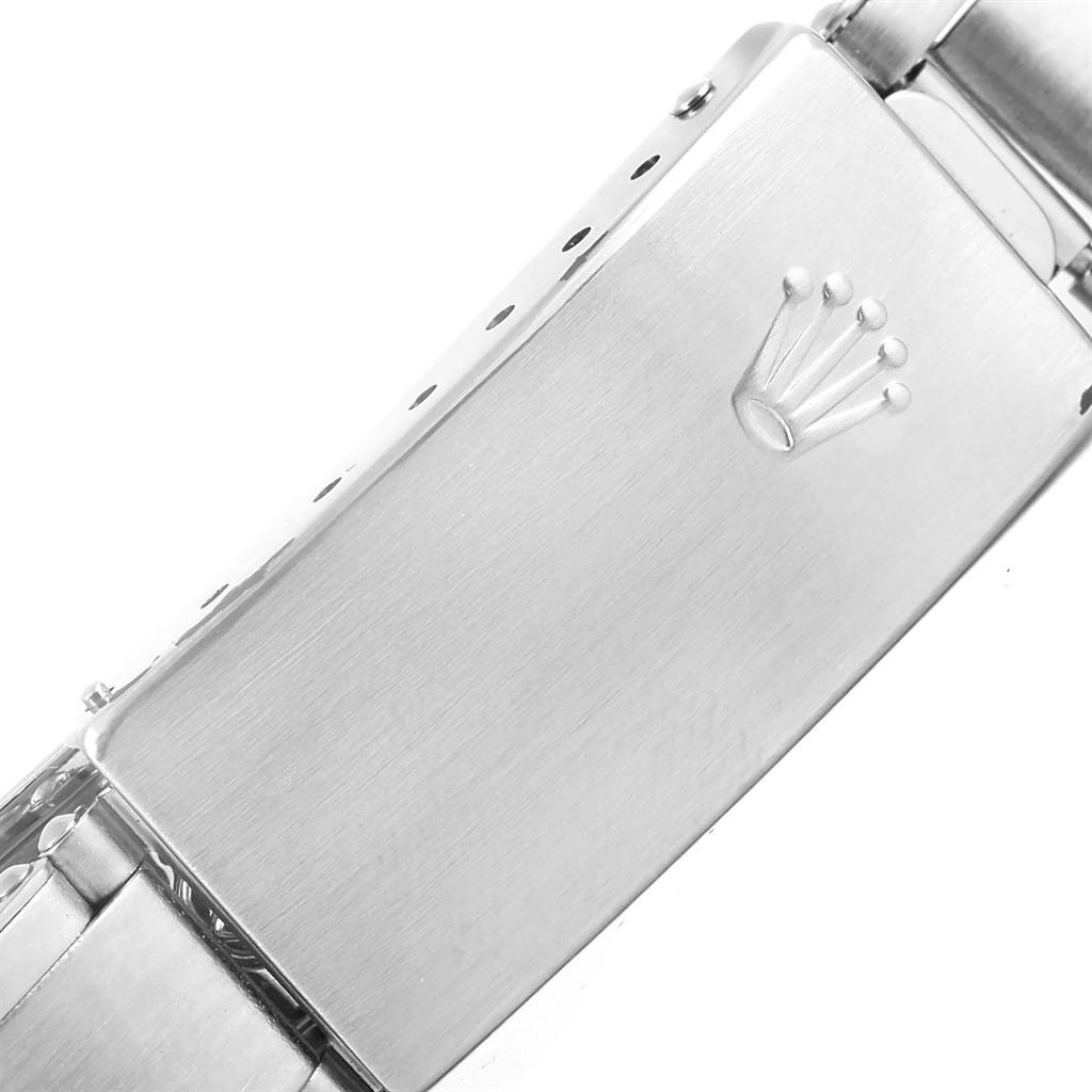 This image shows a close-up of the clasp and part of the bracelet of a Rolex Vintage Collection 1501 Men's Stainless Steel White Dial 1501 Men's Stainless Steel White Dial watch.