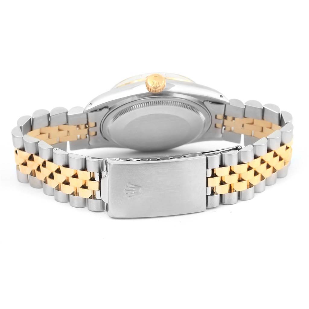 The image shows the back view of a Rolex Vintage Collection 16013 Men's Stainless Steel Champagne Dial 16013 Men's Stainless Steel Champagne Dial watch, highlighting its case back and two-tone bracelet.