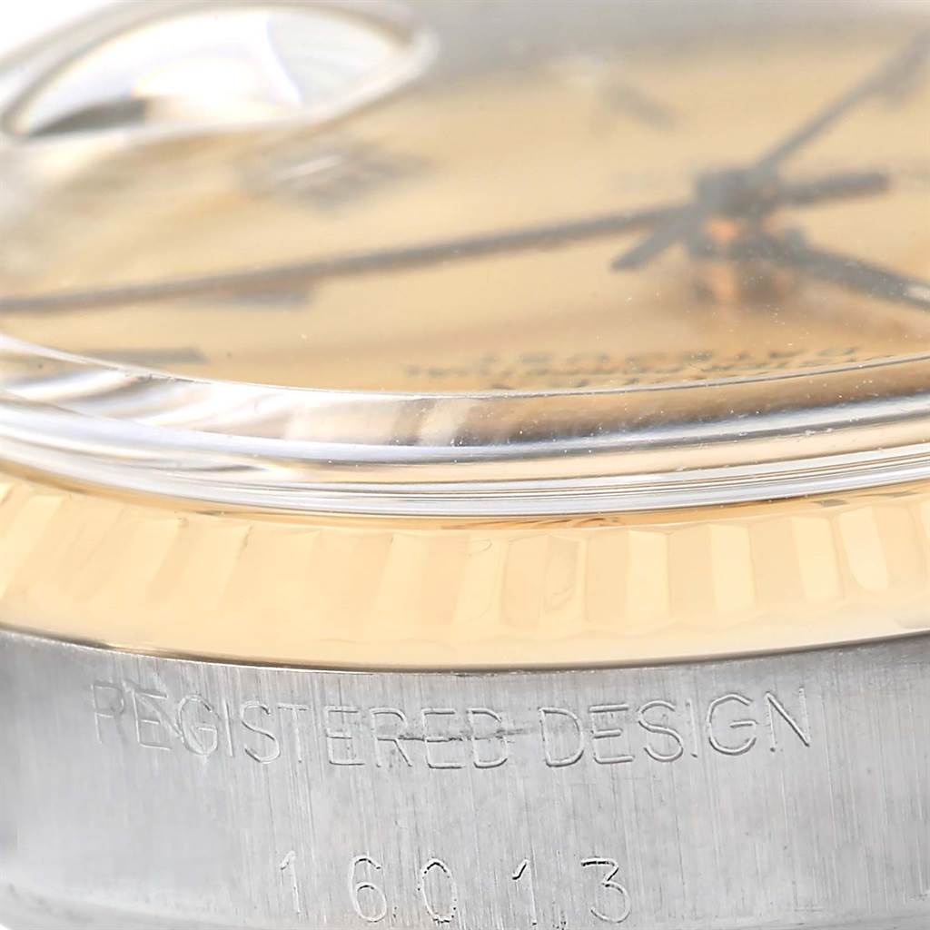 This image shows a close-up side view of a Rolex Vintage Collection 16013 Men's Stainless Steel Champagne Dial 16013 Men's Stainless Steel Champagne Dial watch, focusing on the crystal, dial, and case with the engraving "REGISTERED DESIGN 16013".