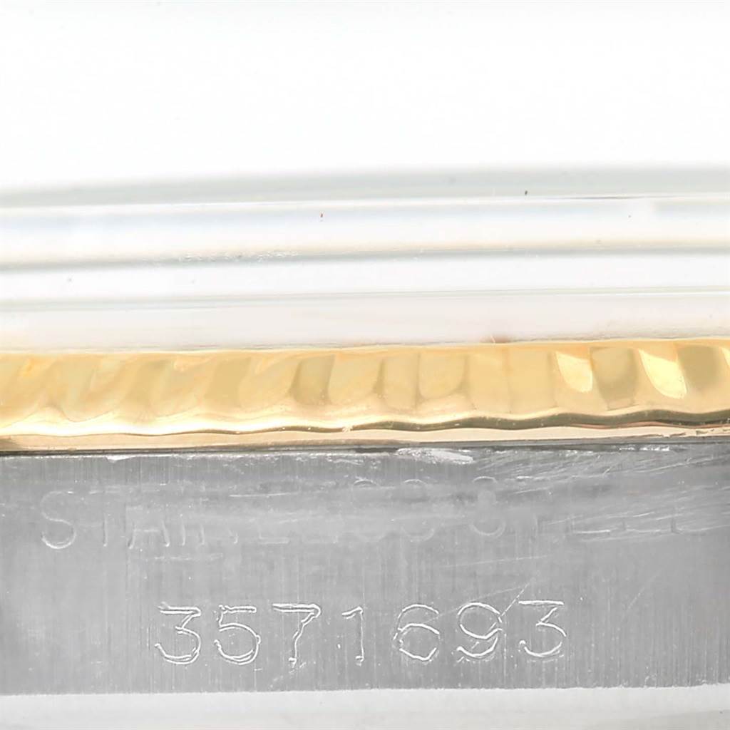 The image shows a close-up of the serial number engraved on the side of a Rolex Vintage Collection 1601 Men's Stainless Steel Champagne Dial 1601 Men's Stainless Steel Champagne Dial watch case.