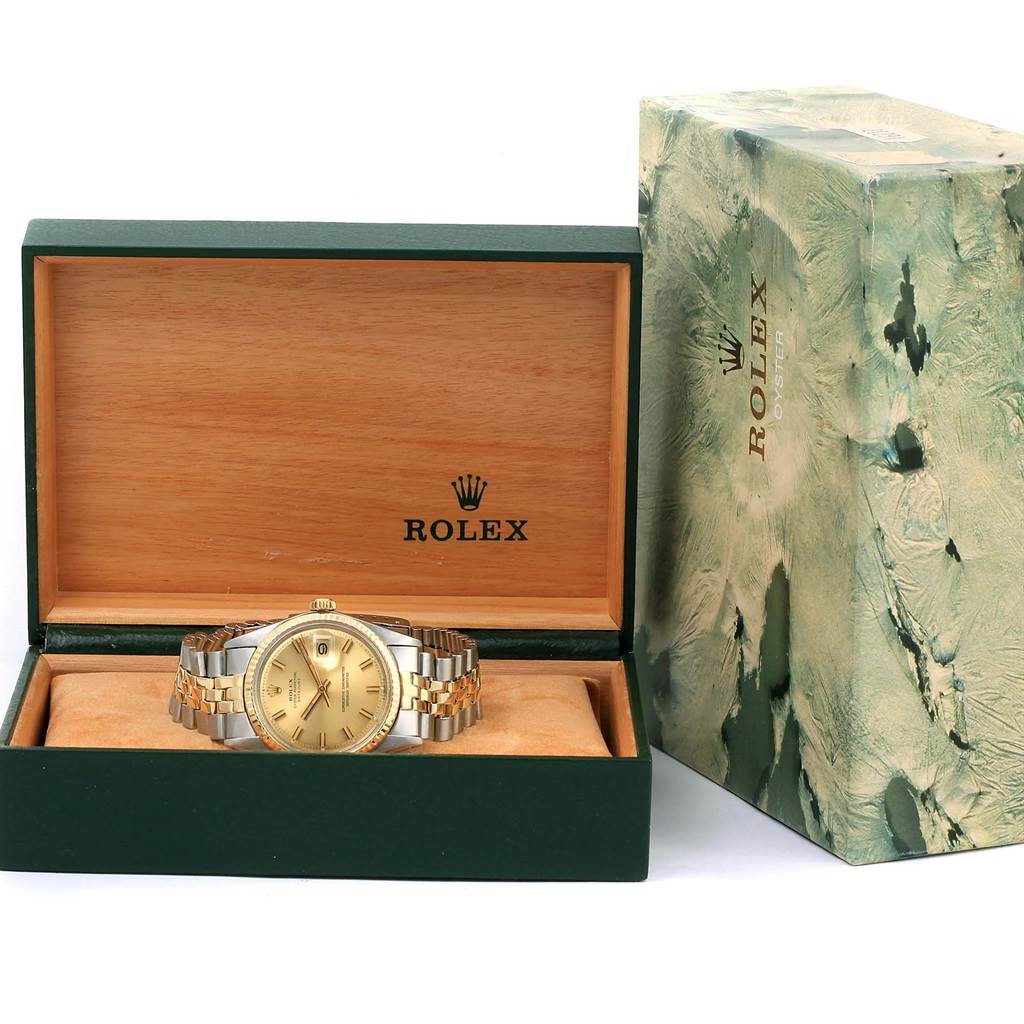 The Vintage Collection Rolex watch is shown in its open box alongside the outer packaging, providing a front view of the watch's face and band.