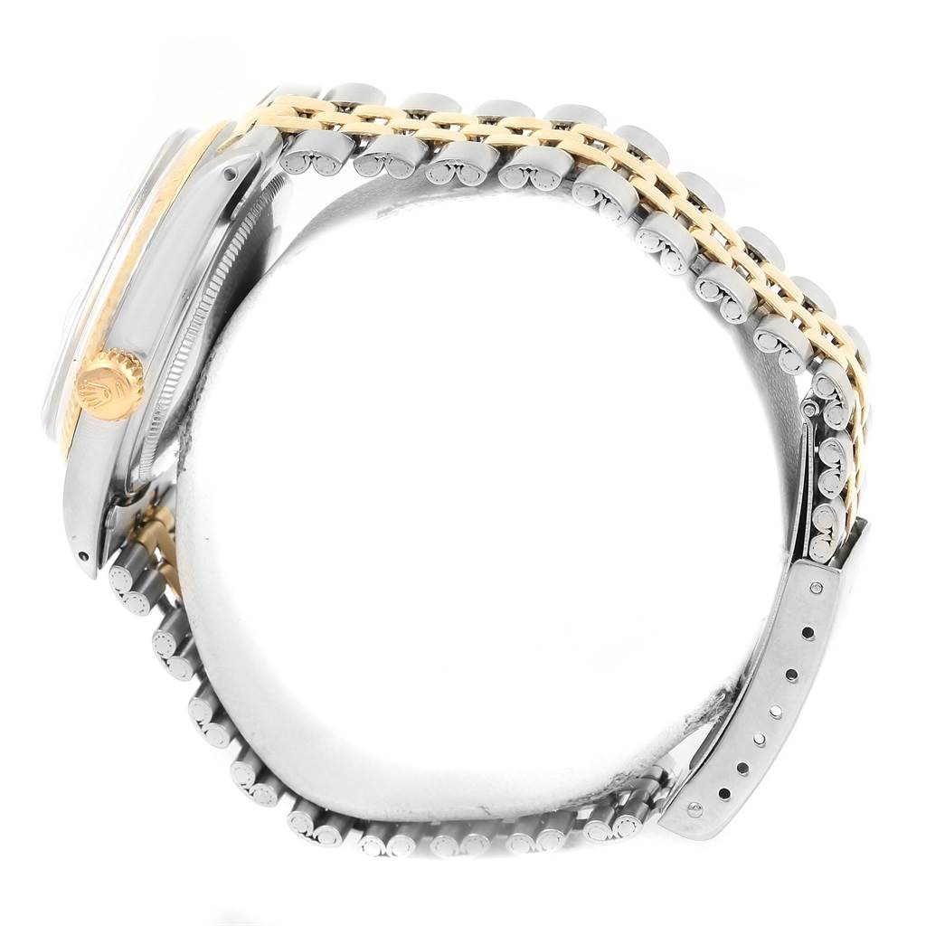 The image shows a side view of the Rolex Vintage Collection 1601 Men's Stainless Steel Champagne Dial 1601 Men's Stainless Steel Champagne Dial watch, highlighting its two-tone bracelet and crown.