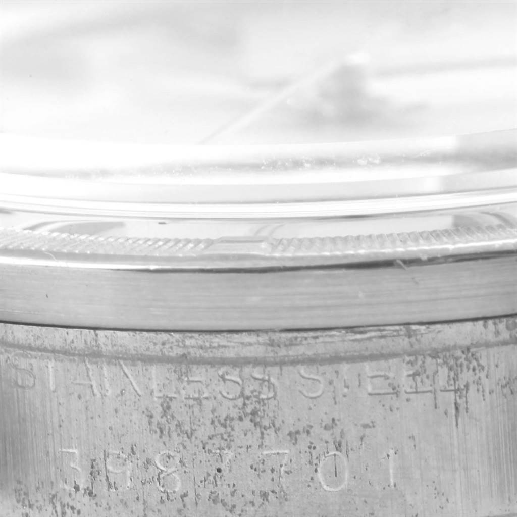 This image shows a close-up side view of the case and bezel of a Vintage Collection model by Rolex, highlighting the stainless steel material.