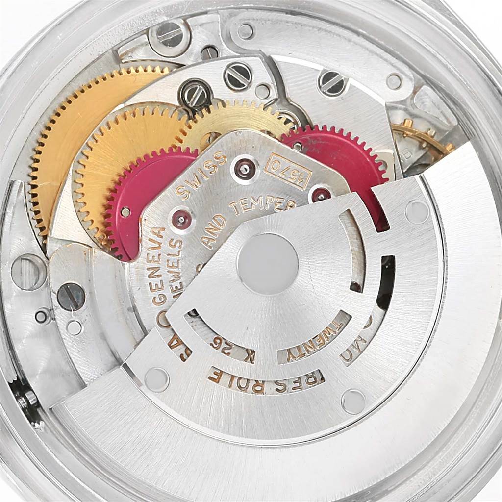 The image shows an internal view of the movement gears and mechanical components of a Vintage Collection model by Rolex.