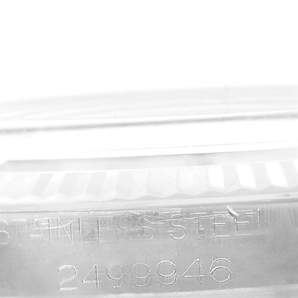 The image shows a close-up of the serial number and "STAINLESS STEEL" inscription on the case side of the Rolex Vintage Collection 1603 Men's Stainless Steel Grey Dial 1603 Men's Stainless Steel Grey Dial model.