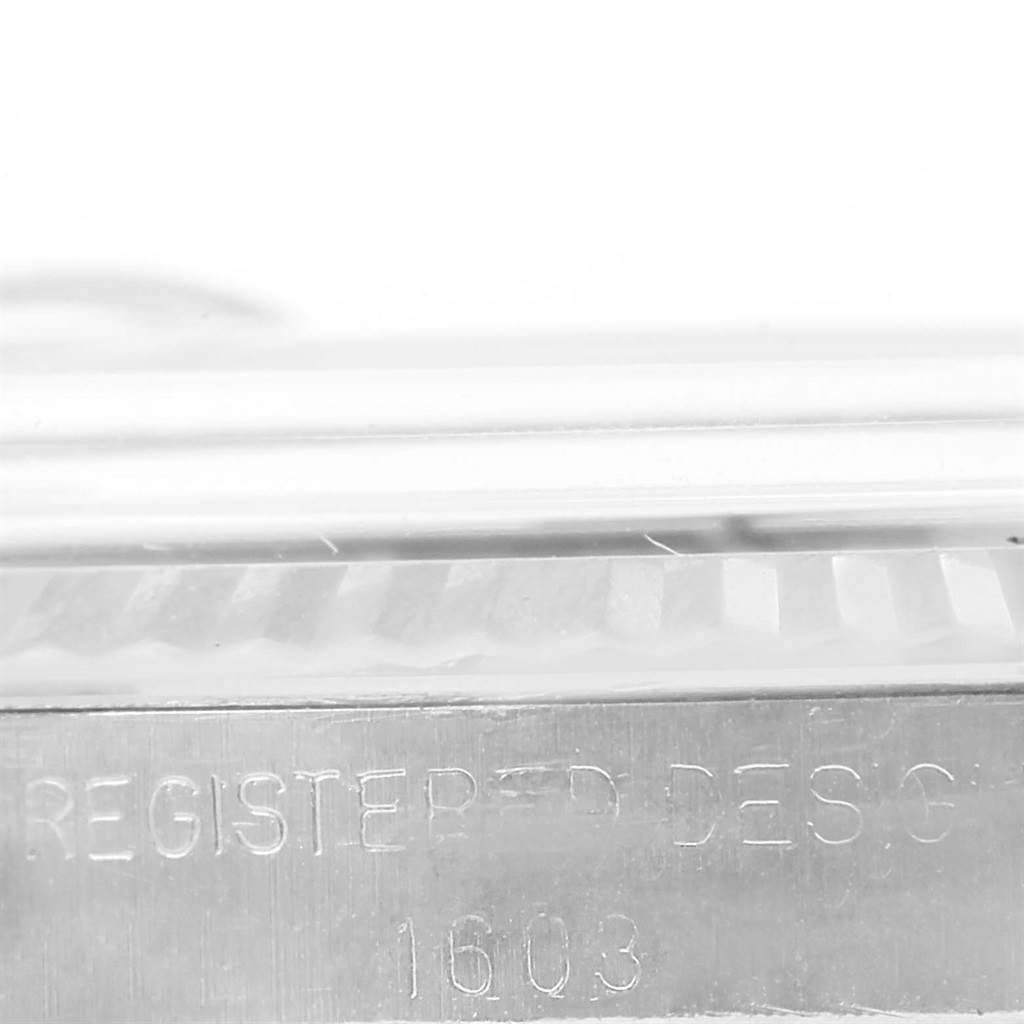 This image shows a close-up side view of the case and bezel of a Rolex Vintage Collection 1603 Men's Stainless Steel Grey Dial 1603 Men's Stainless Steel Grey Dial model, highlighting the engraved model number 1603.