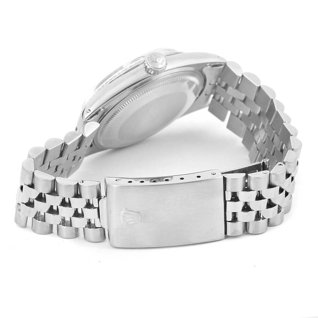 This image shows a Vintage Collection model by Rolex from a rear angle, highlighting its metal bracelet and clasp.