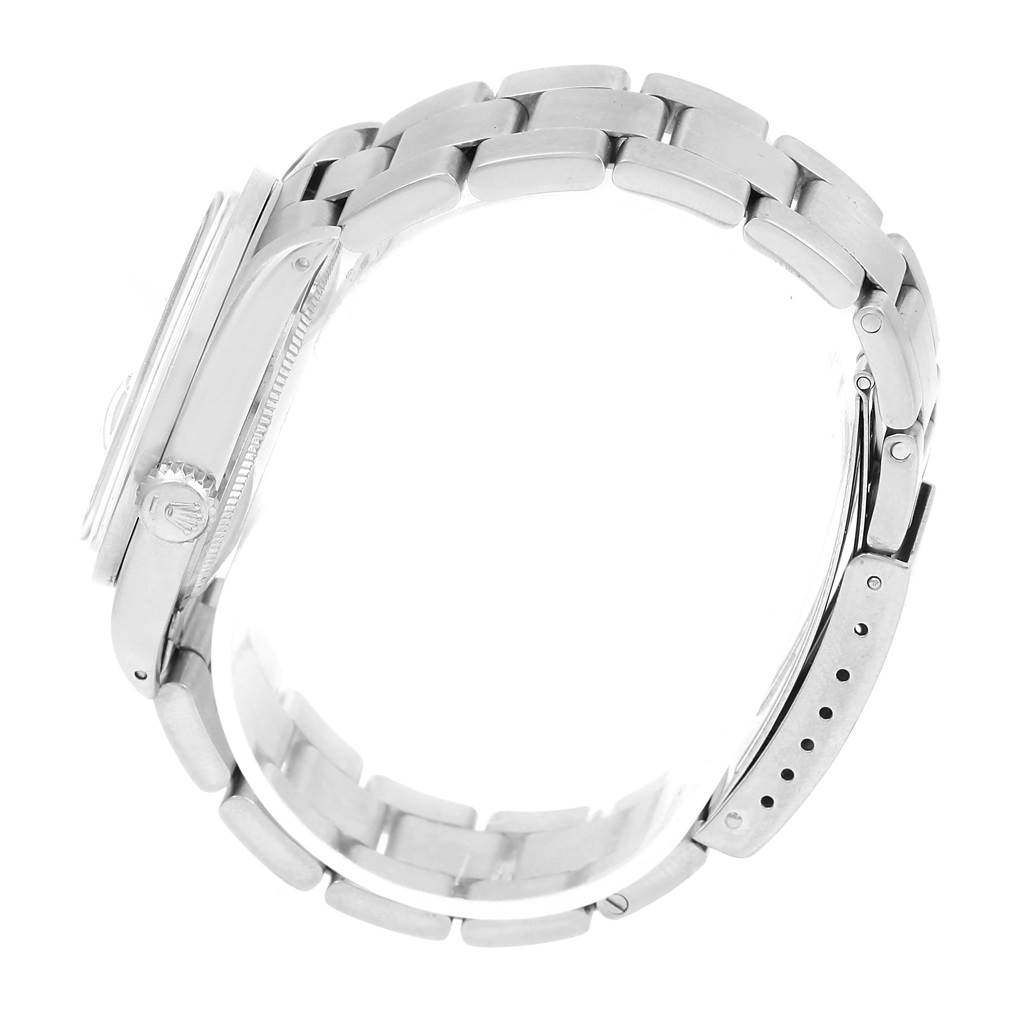 The image shows a side view of the Rolex Vintage Collection 1500 Men's Stainless Steel Silver Dial 1500 Men's Stainless Steel Silver Dial watch, highlighting the bracelet and the crown.