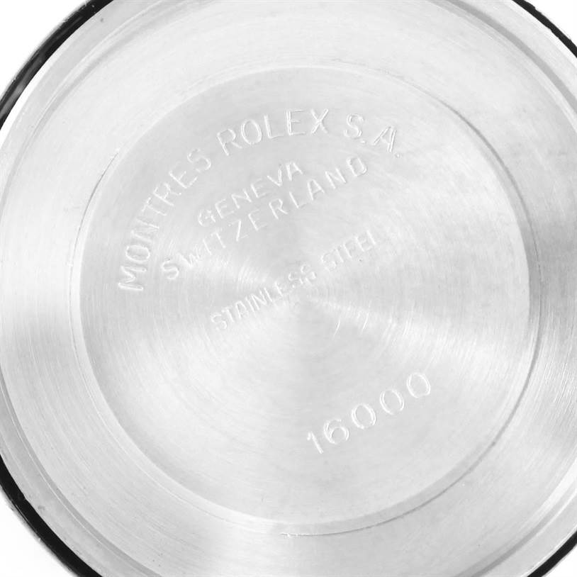 This is the back case of a Vintage Collection model by Rolex, showing the engraved details and model number 16000.