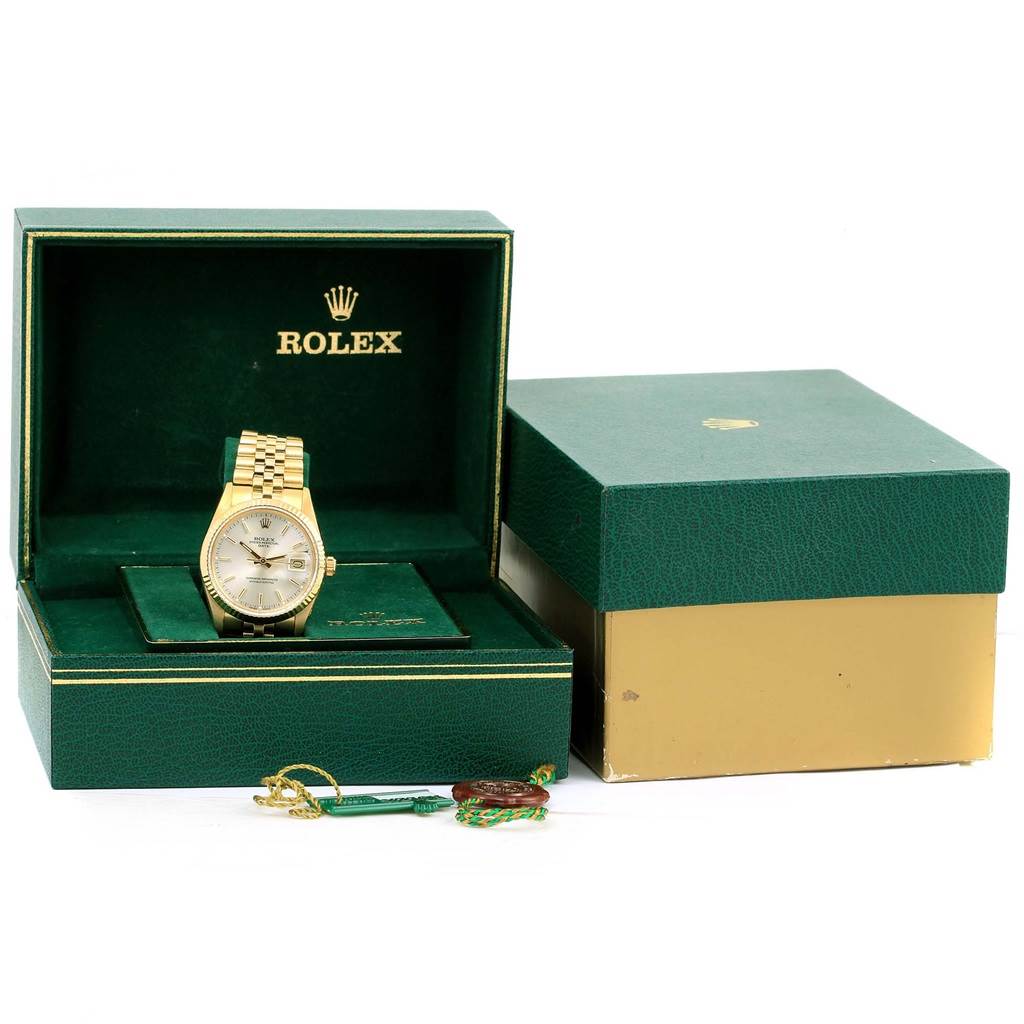 The Rolex Vintage Collection 15037 Men's Yellow Gold Silver Dial 15037 Men's Yellow Gold Silver Dial watch is shown at a frontal angle in its green and gold box along with accessories and an outer box.