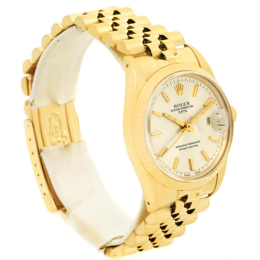 The image shows a side and partial front view of a Rolex Vintage Collection 15037 Men's Yellow Gold Silver Dial 15037 Men's Yellow Gold Silver Dial watch, highlighting the face, bezel, and bracelet.