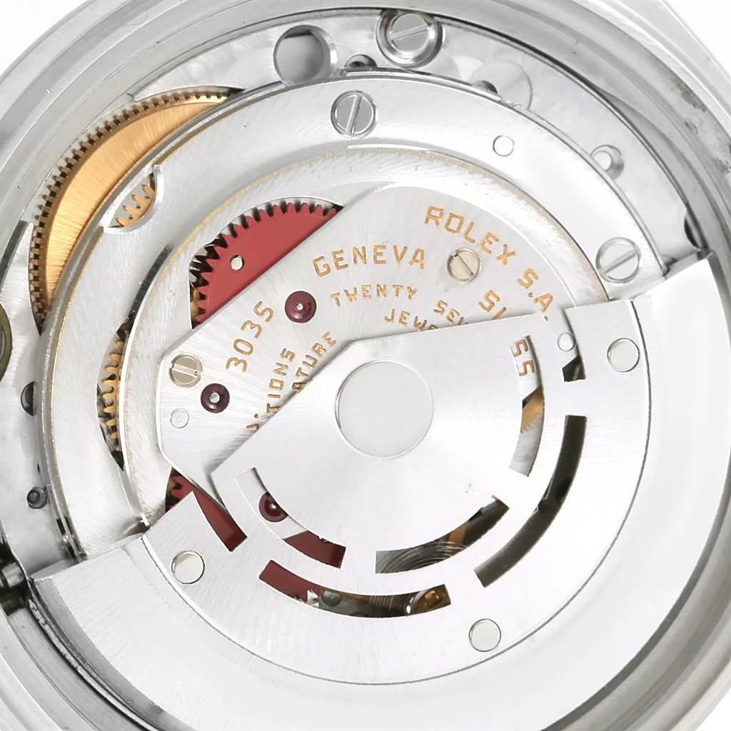 This close-up image shows the intricate inner mechanical movement of a Rolex Vintage Collection 16014 Men's Stainless Steel Silver Dial 16014 Men's Stainless Steel Silver Dial watch model 3035.