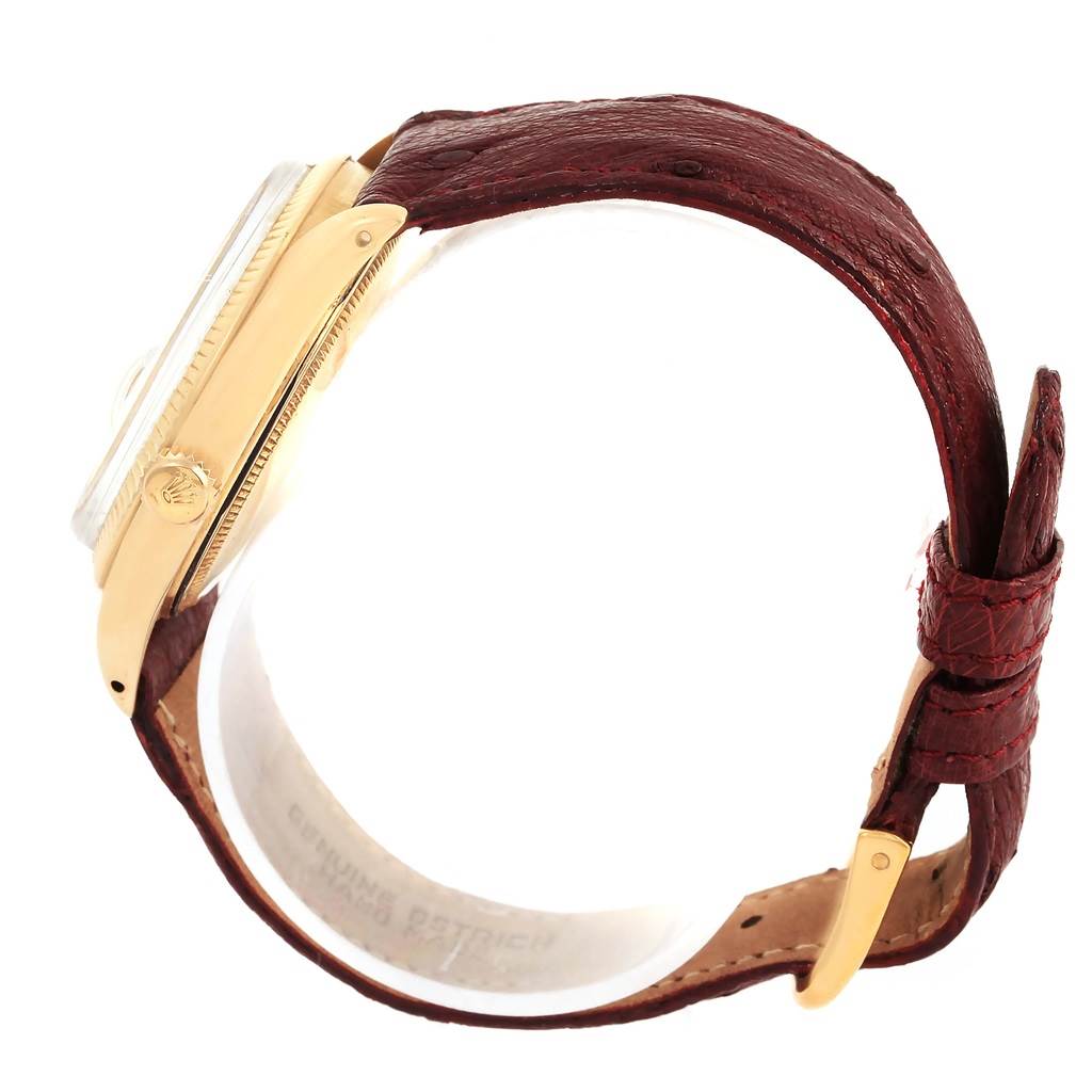 The image shows a side view of the Rolex Vintage Collection 1503 Men's Yellow Gold White Dial 1503 Men's Yellow Gold White Dial watch featuring its gold casing and brown leather strap.