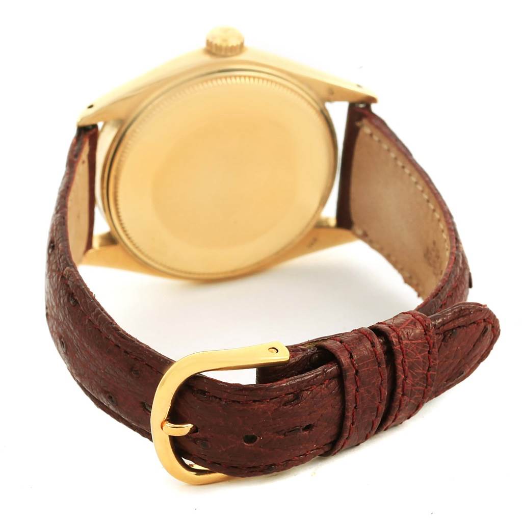 The image shows the back of the case and the brown leather strap with buckle of the Rolex Vintage Collection 1503 Men's Yellow Gold White Dial 1503 Men's Yellow Gold White Dial watch.