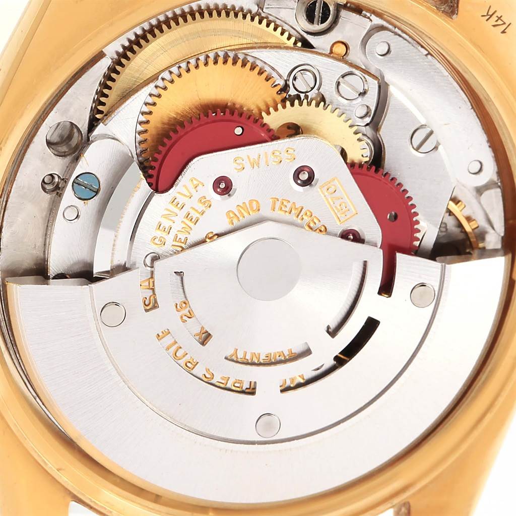 The image showcases the intricate inner mechanics of a Vintage Collection model by Rolex, photographed from the caseback.