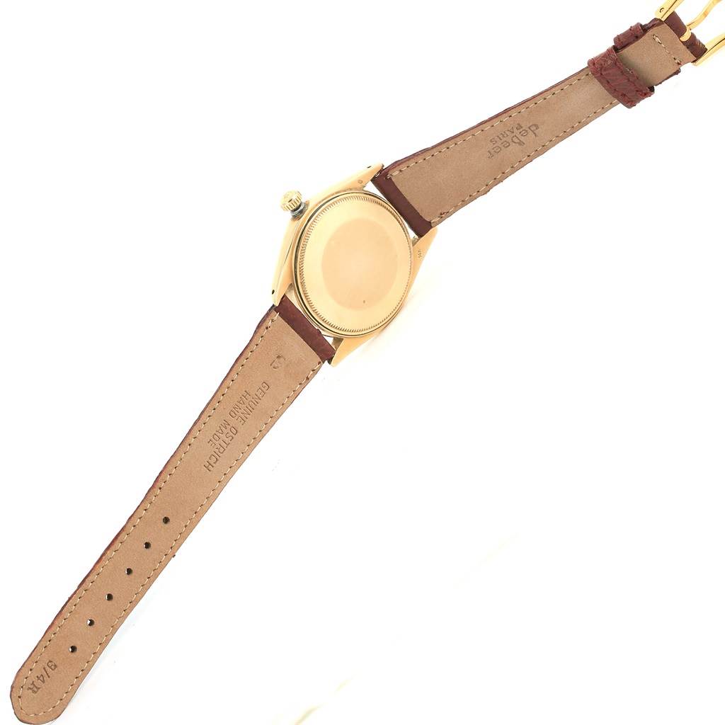 The image shows the back view of the Rolex Vintage Collection 1503 Men's Yellow Gold White Dial 1503 Men's Yellow Gold White Dial model watch, displaying its case back and leather straps.