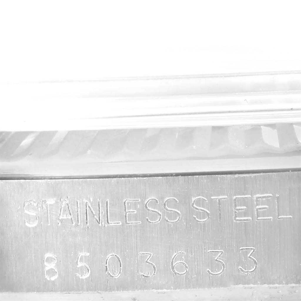 The image shows the side engraving of a Rolex Vintage Collection 16014 Men's Stainless Steel Silver Dial 16014 Men's Stainless Steel Silver Dial watch, including "STAINLESS STEEL" and a serial number.