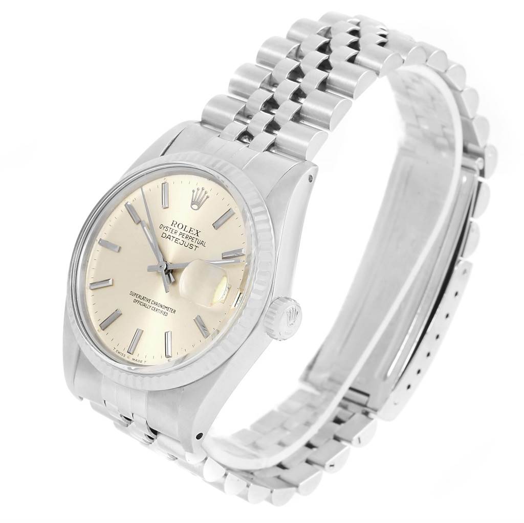 This image shows a side angle of the Rolex Vintage Collection 16014 Men's Stainless Steel Silver Dial 16014 Men's Stainless Steel Silver Dial Datejust watch, featuring its dial, crown, and metal bracelet.