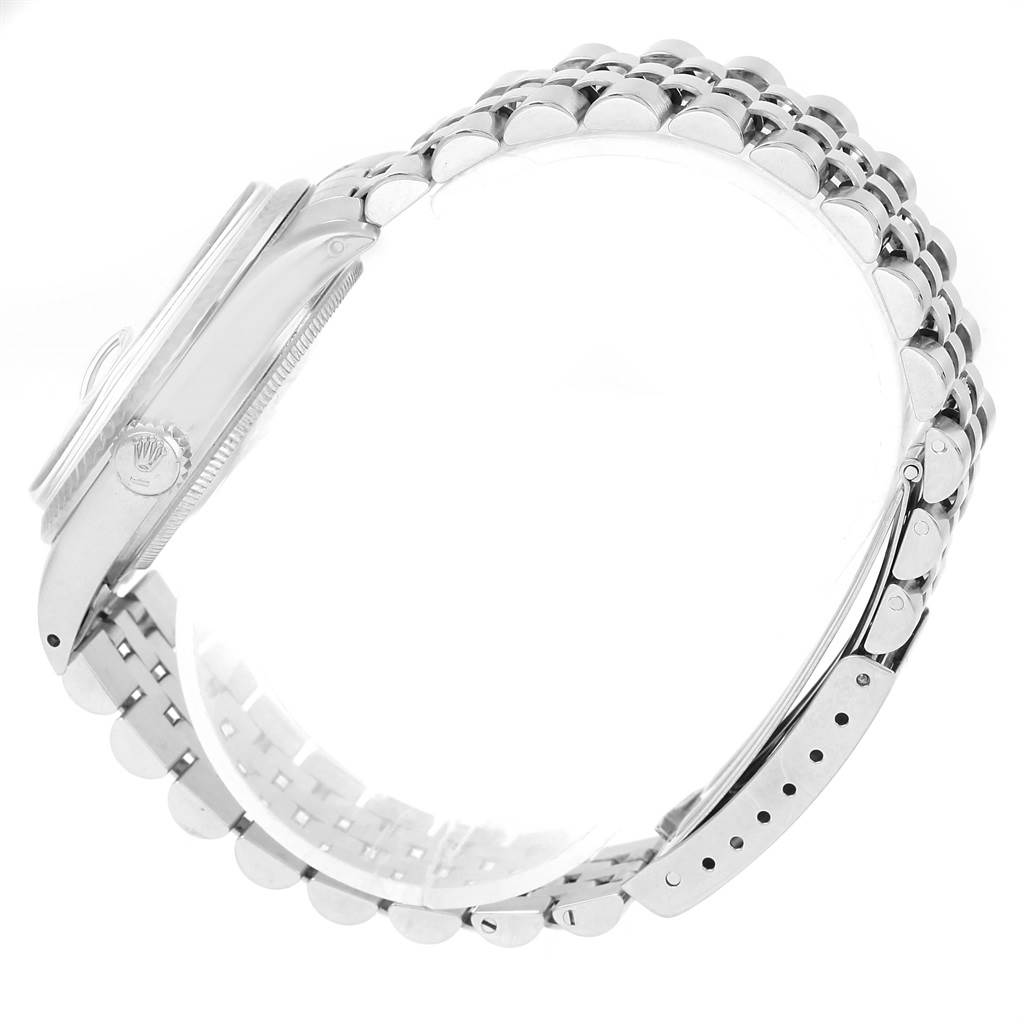 This image shows a side view of the Rolex Vintage Collection 16014 Men's Stainless Steel Silver Dial 16014 Men's Stainless Steel Silver Dial watch, highlighting the case, crown, and bracelet.