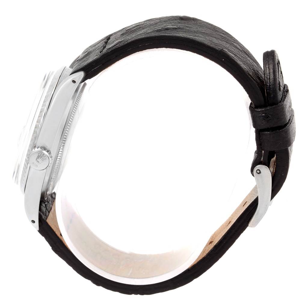 This image shows a side view of the Rolex Vintage Collection 1601 Men's Stainless Steel Black Dial 1601 Men's Stainless Steel Black Dial watch featuring the crown, case, and leather strap.