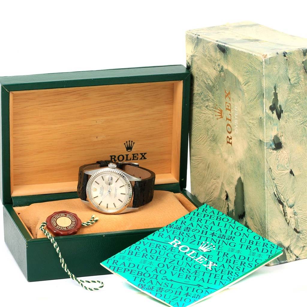 The Rolex Vintage Collection 1601 Men's Stainless Steel Black Dial 1601 Men's Stainless Steel Black Dial watch is shown inside its open box, with a manual and a tag included.