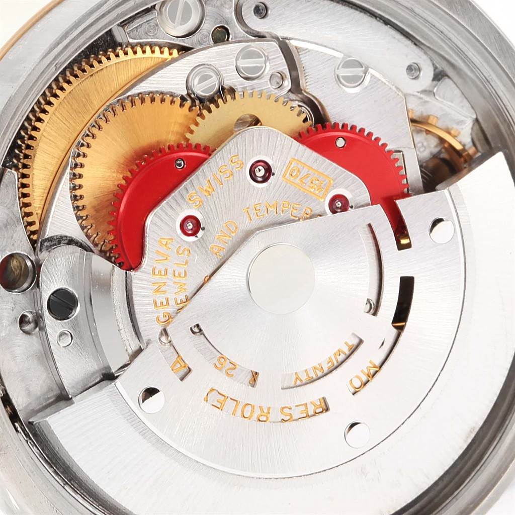This image shows an up-close view of the mechanical movement inside a Vintage Collection model by Rolex, highlighting gears and intricate components.