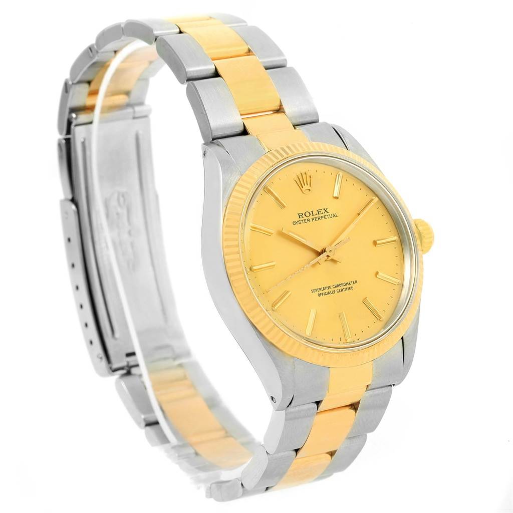 The Rolex Vintage Collection 1005 Men's Steel and Gold (two tone) Champagne Dial 1005 Men's Steel and Gold (two tone) Champagne Dial watch is shown at a slight angle, featuring the face, bezel, crown, and partially open bracelet.