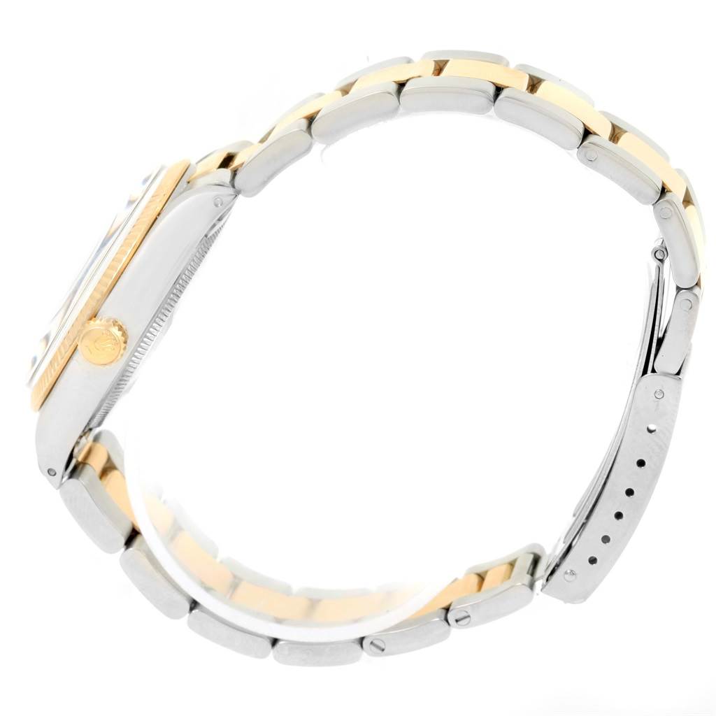 The image shows a side view of a Rolex Vintage Collection 1005 Men's Steel and Gold (two tone) Champagne Dial 1005 Men's Steel and Gold (two tone) Champagne Dial watch, highlighting the wristband and crown.