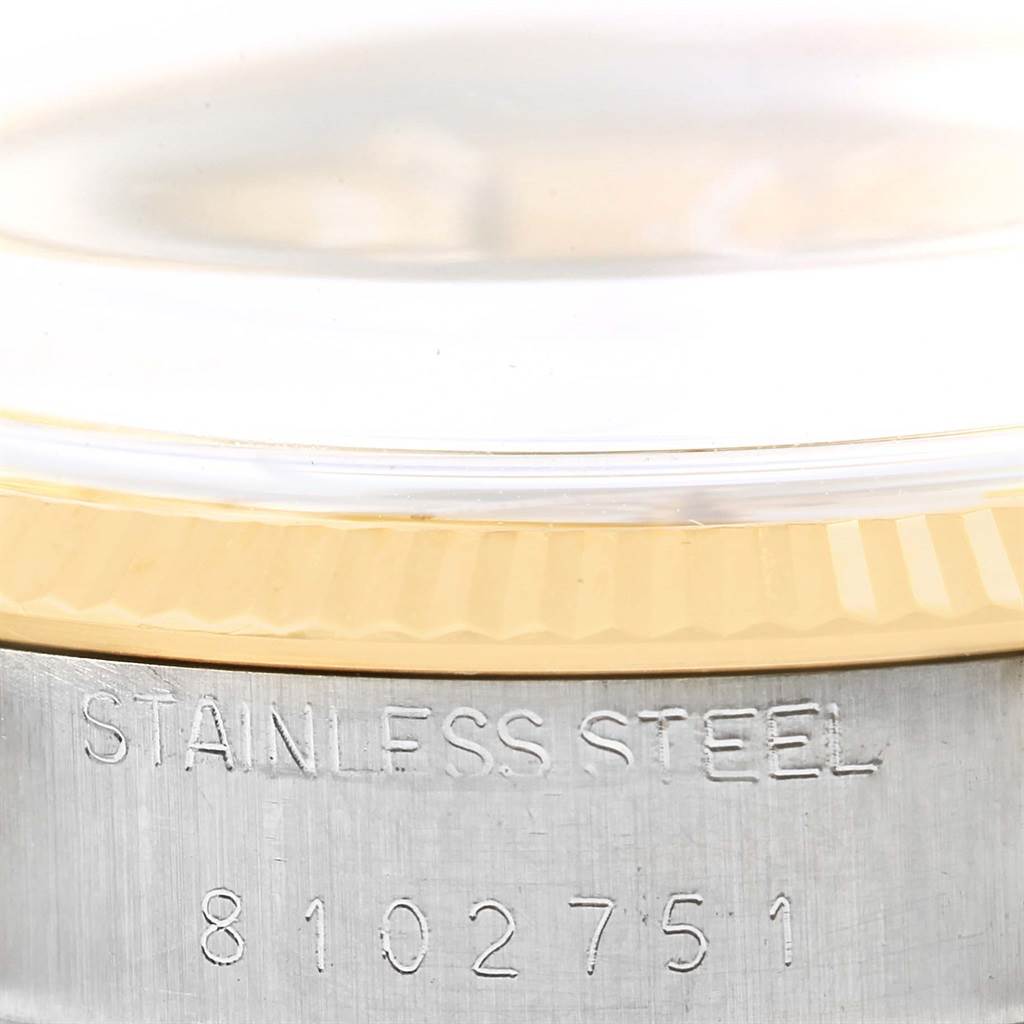 The image shows a close-up of the case side of a Rolex Vintage Collection 1005 Men's Steel and Gold (two tone) Champagne Dial 1005 Men's Steel and Gold (two tone) Champagne Dial watch, displaying "STAINLESS STEEL" and serial number "8102751".