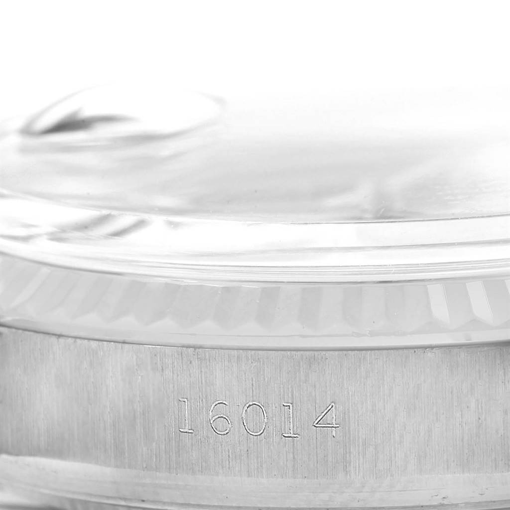 The image shows a close-up side view of the case and bezel of a Rolex Vintage Collection 16014 Men's Stainless Steel Silver Dial 16014 Men's Stainless Steel Silver Dial model, highlighting the model number 16014.