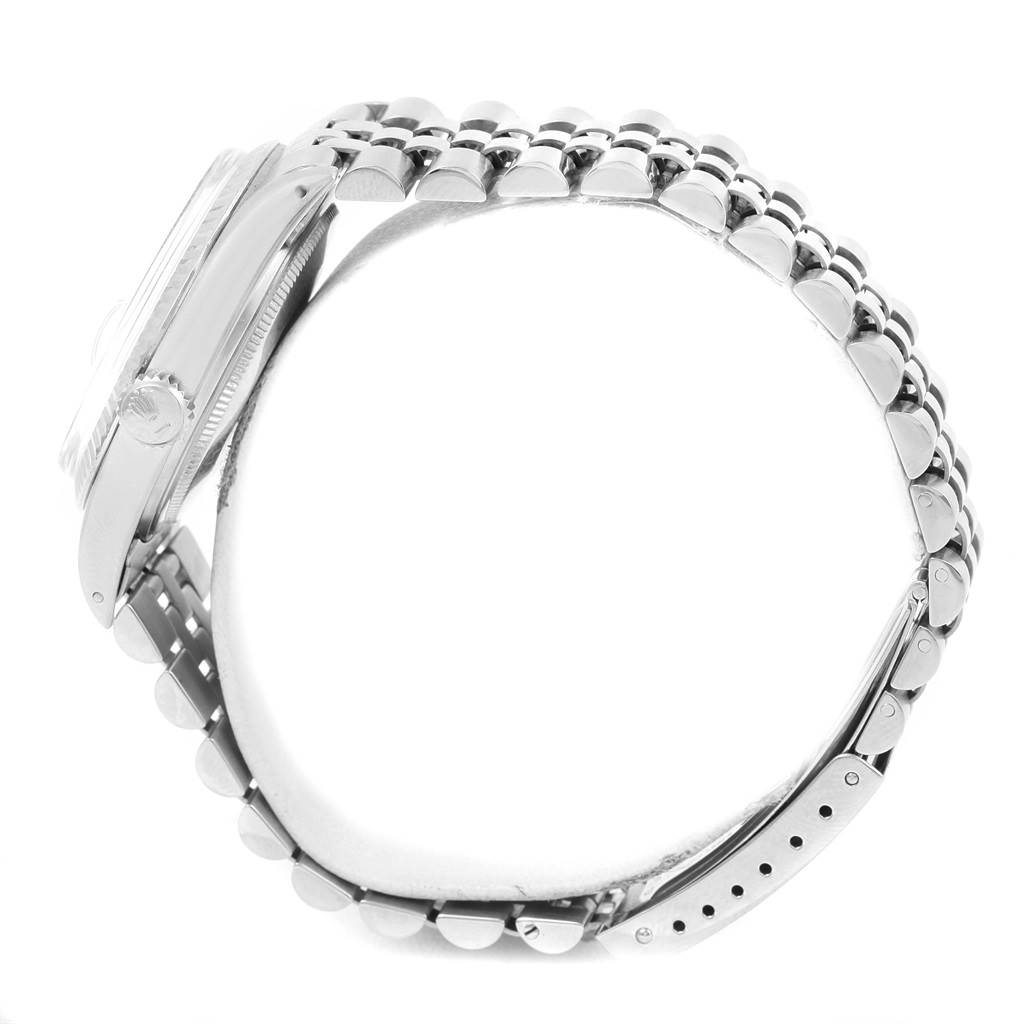 The image shows a side view of the Rolex Vintage Collection 16014 Men's Stainless Steel Silver Dial 16014 Men's Stainless Steel Silver Dial watch, highlighting its case, crown, and bracelet.