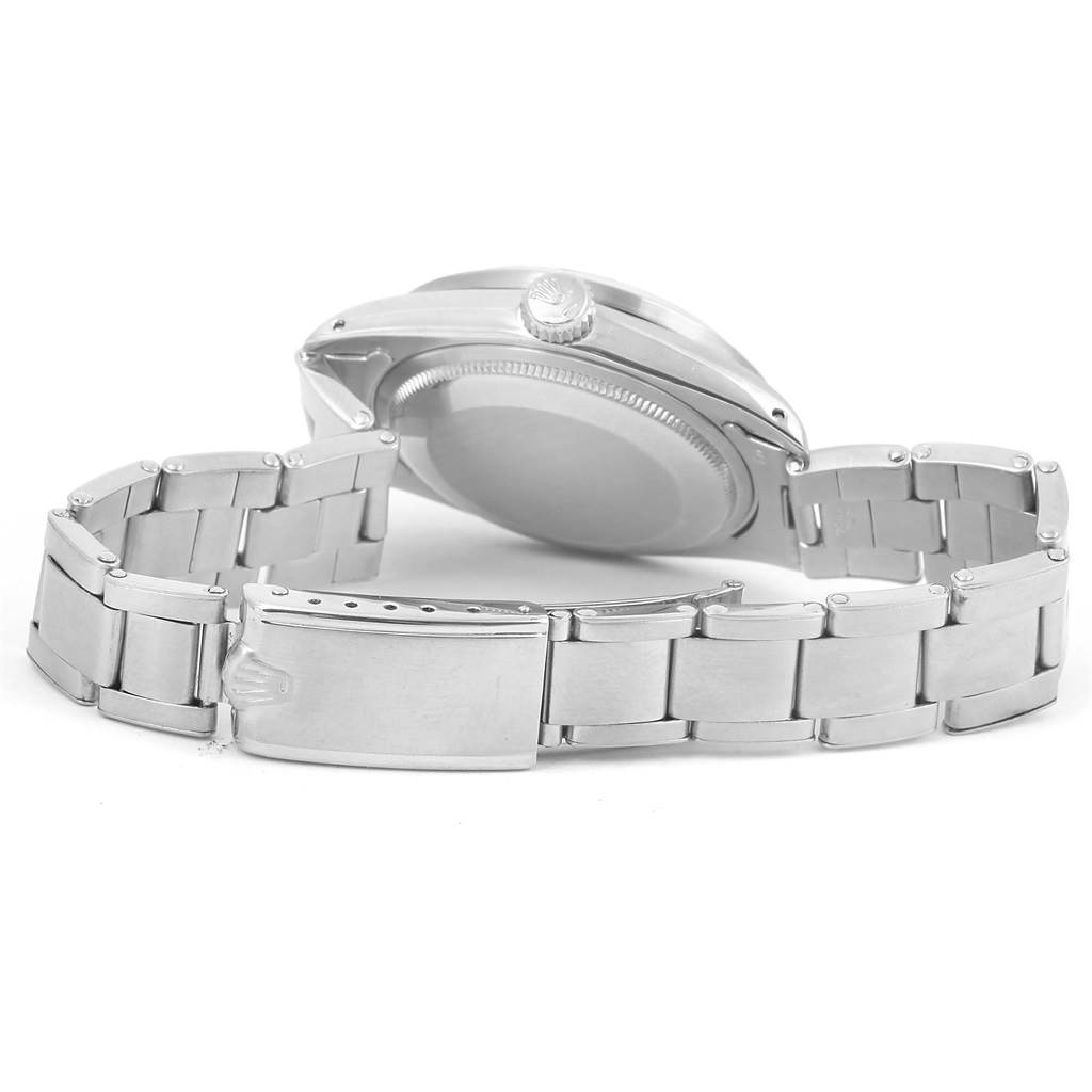 The image shows the back case and bracelet of the Vintage Collection model by Rolex from a bottom angle.