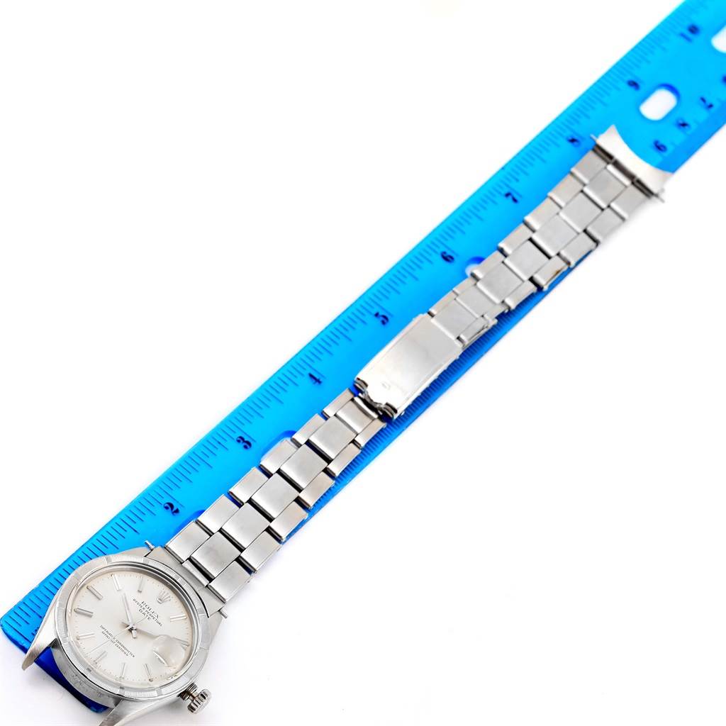 The image shows the entire face and band of the Vintage Collection Rolex watch aligned with a blue ruler.