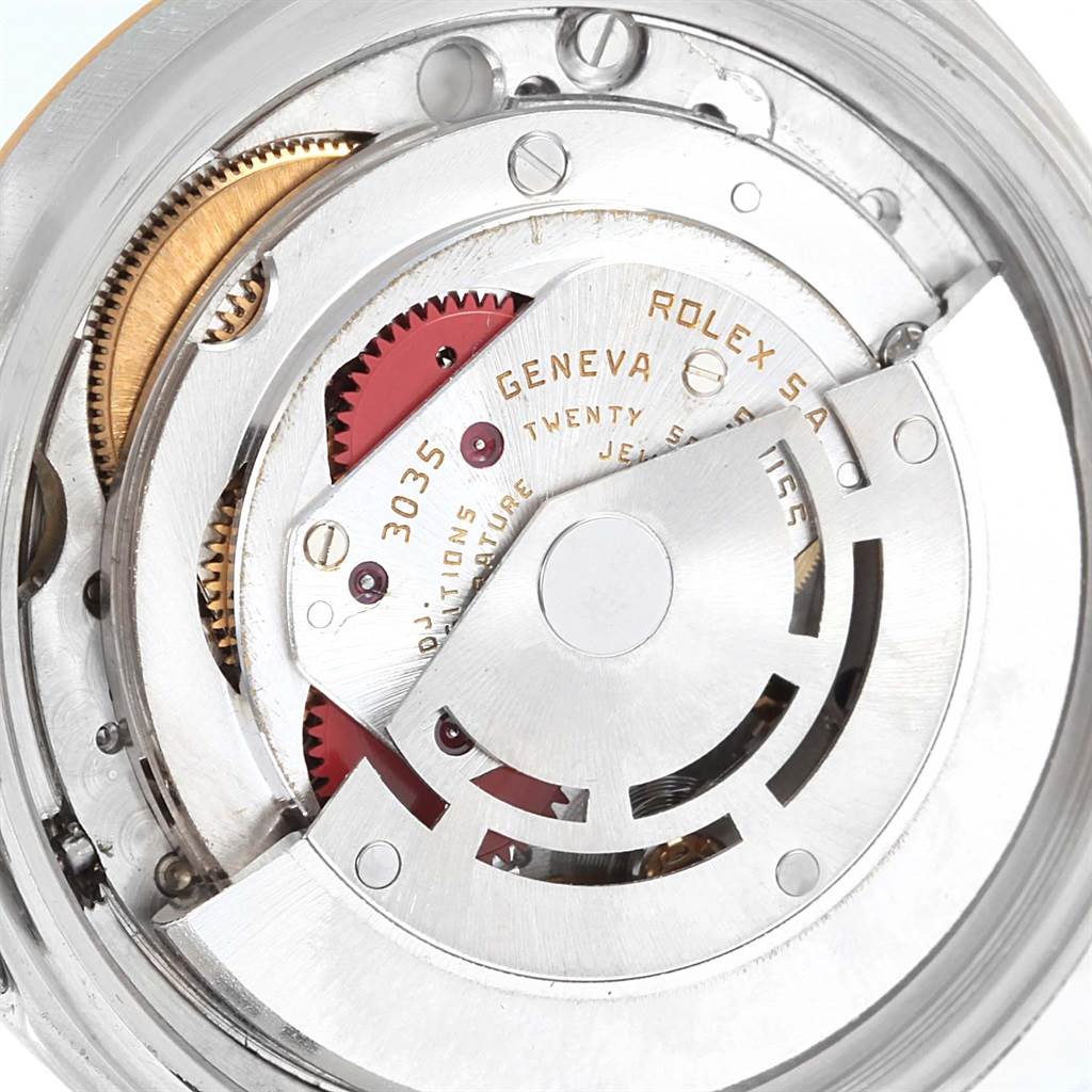 The image shows the internal mechanical movement of a Rolex Vintage Collection ROLEX DATEJUST STEEL YELLOW GOLD TAPESTRY DIAL VINTAGE MENS WATCH 16013 Men's Stainless Steel Silver Dial ROLEX DATEJUST STEEL YELLOW GOLD TAPESTRY DIAL VINTAGE MENS WATCH 16013 Men's Stainless Steel Silver Dial watch, highlighting gears and engravings.