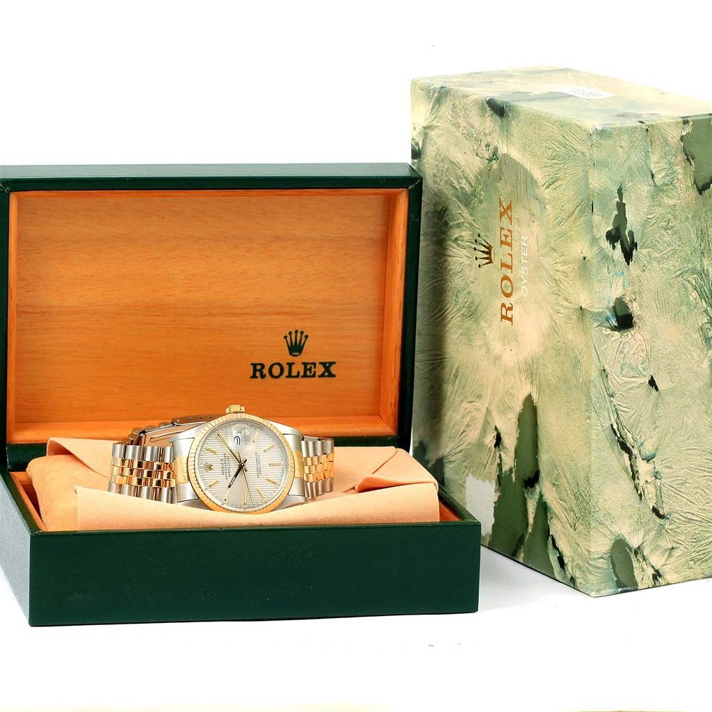 The image shows a Rolex Vintage Collection ROLEX DATEJUST STEEL YELLOW GOLD TAPESTRY DIAL VINTAGE MENS WATCH 16013 Men's Stainless Steel Silver Dial ROLEX DATEJUST STEEL YELLOW GOLD TAPESTRY DIAL VINTAGE MENS WATCH 16013 Men's Stainless Steel Silver Dial watch resting in its box alongside the packaging.