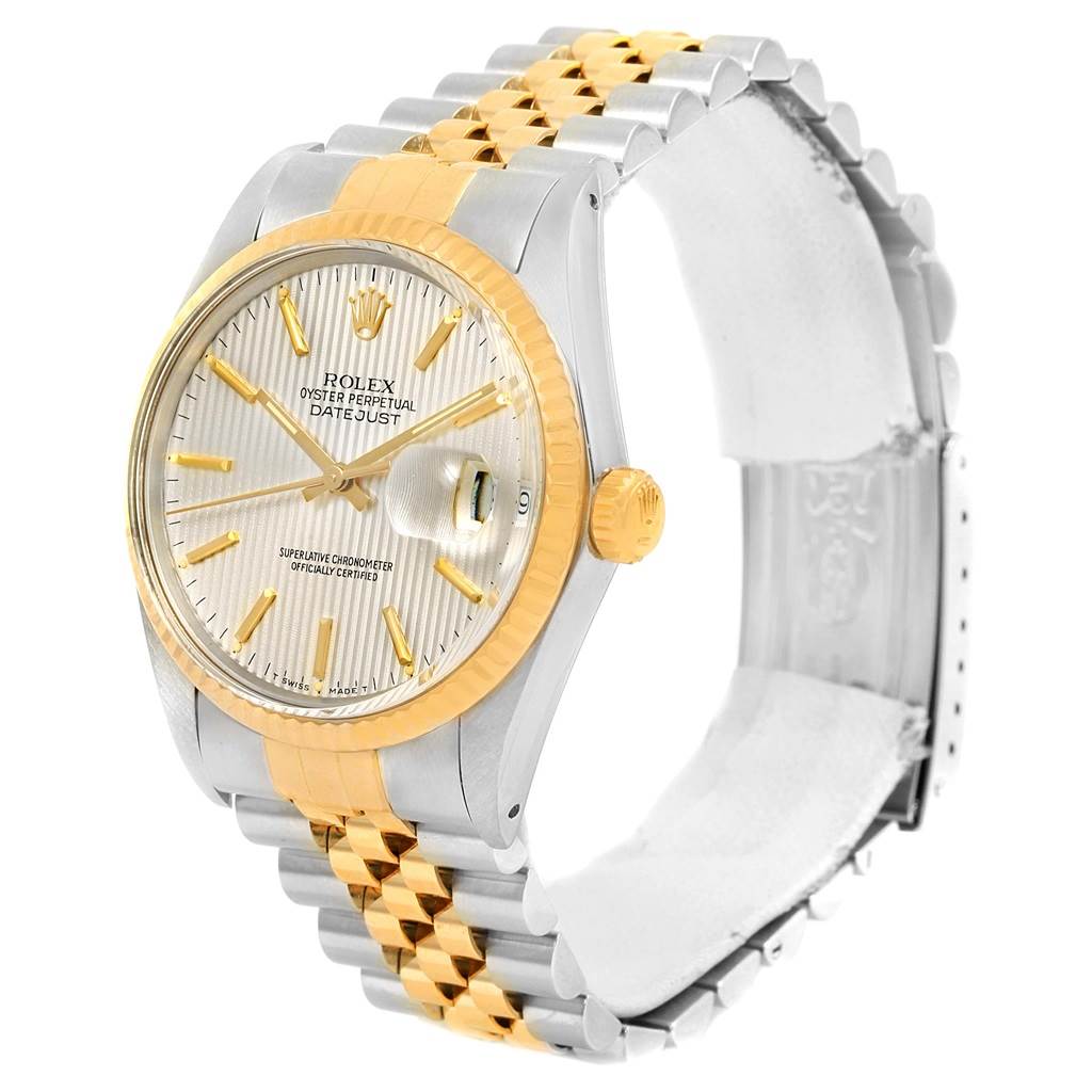 This Rolex watch from the Vintage Collection model is shown at an angle, displaying its bezel, dial, crown, and two-tone bracelet.