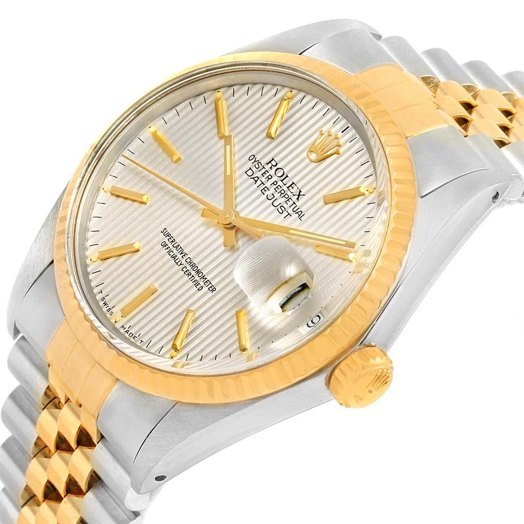 This image shows a side angle of the Rolex Vintage Collection ROLEX DATEJUST STEEL YELLOW GOLD TAPESTRY DIAL VINTAGE MENS WATCH 16013 Men's Stainless Steel Silver Dial ROLEX DATEJUST STEEL YELLOW GOLD TAPESTRY DIAL VINTAGE MENS WATCH 16013 Men's Stainless Steel Silver Dial model, highlighting the watch face, bezel, and part of the bracelet.