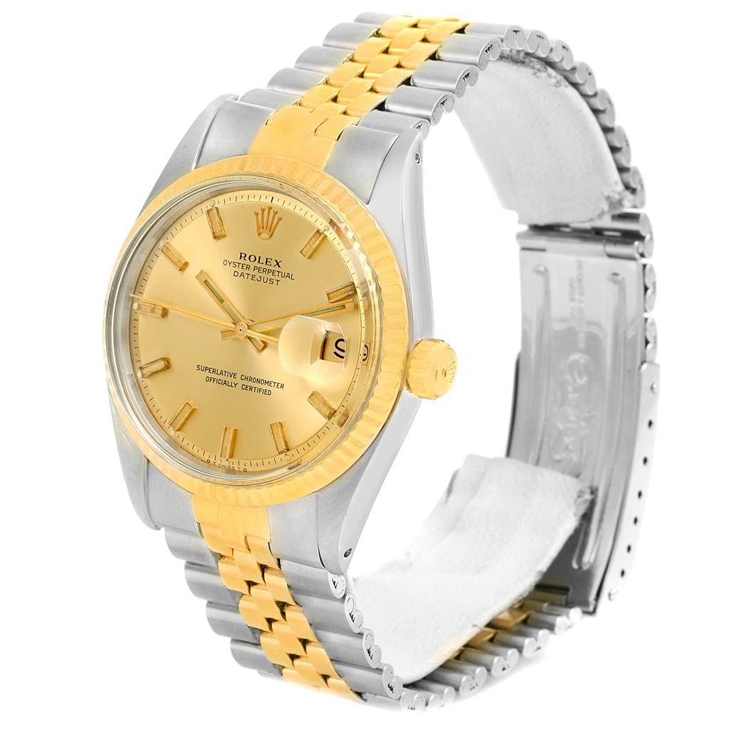 The Rolex Vintage Collection 1601 Men's Stainless Steel Champagne Dial 1601 Men's Stainless Steel Champagne Dial watch is shown at a slight angle, highlighting the gold and silver band, the dial, bezel, and the crown.