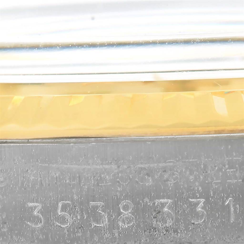 The image shows a close-up angle of the serial number, bezel, and case of a Vintage Collection model by Rolex.